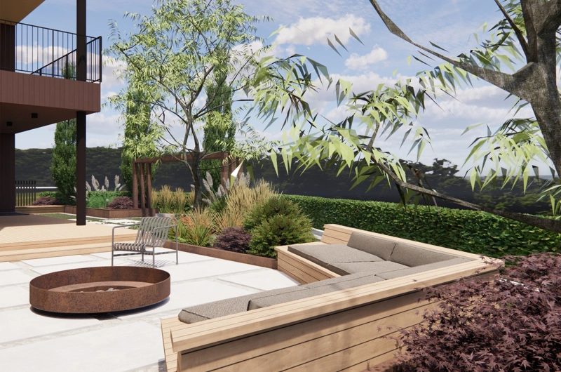 Moderni oleskelupiha Oulussa pihasuunnittelijan toteuttamana – corten-teräs, tulipata, sohva ja huoliteltu pihakiveys.